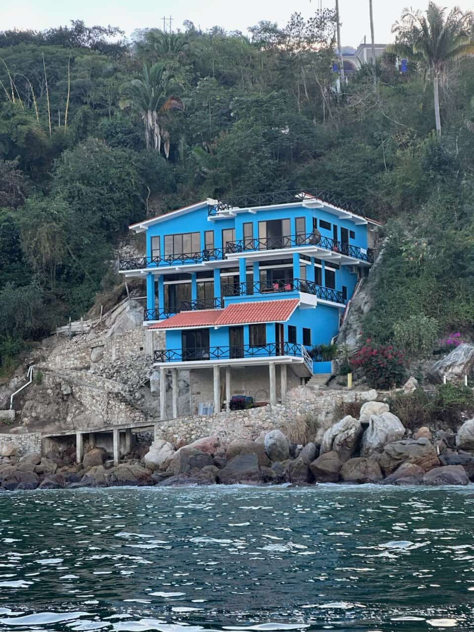 Casa Altamar from the water, on the rocks at the point of Yelapa Bay