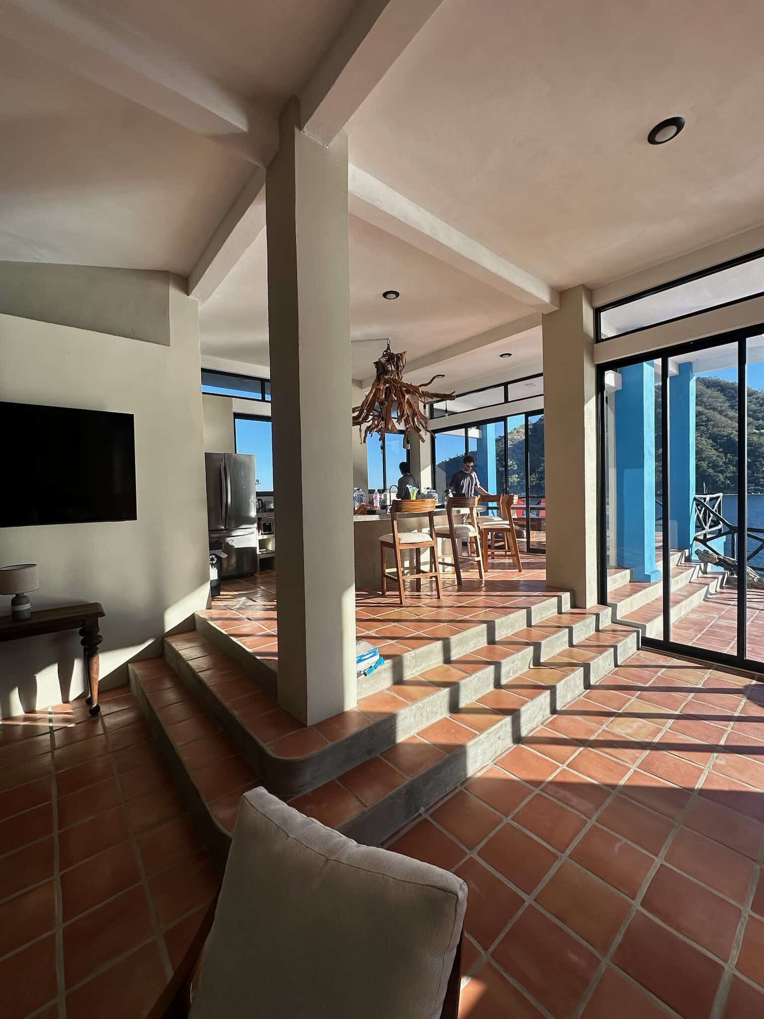 Main level: living room, dining area and glass doors to the ocean
